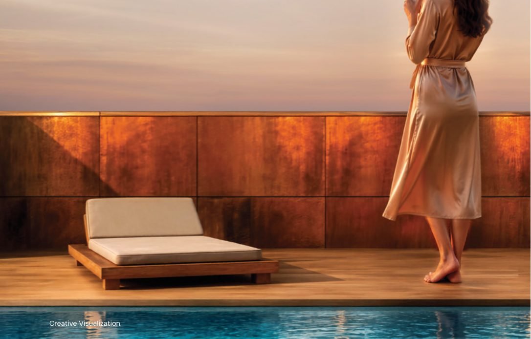 Brigade Barcelona pool deck at dusk with timber deck and lounger